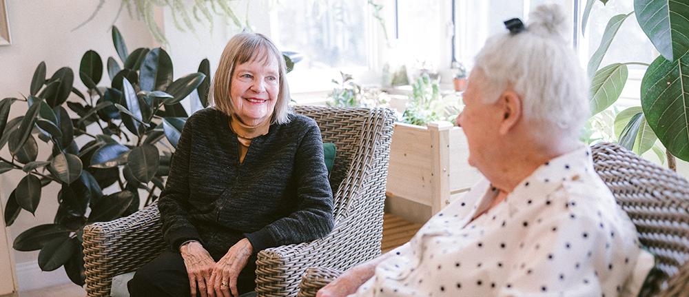 Residents interacting in a supportive, resident‑focused setting at Ohio Living Ganzhorn Suites in Powell, Ohio, offering dementia and Alzheimer’s memory care.