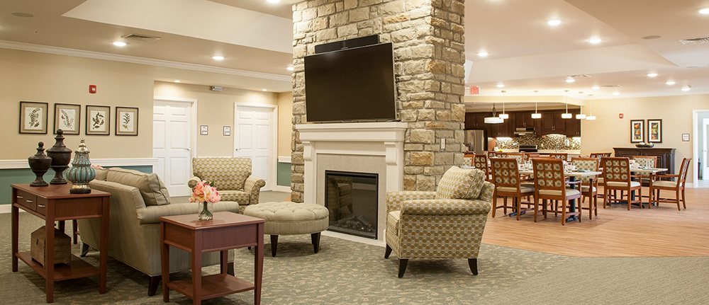 Inviting household common room at Ohio Living Ganzhorn Suites, a Powell, Ohio memory care community specializing in dementia and Alzheimer’s care with meaningful family engagement.
